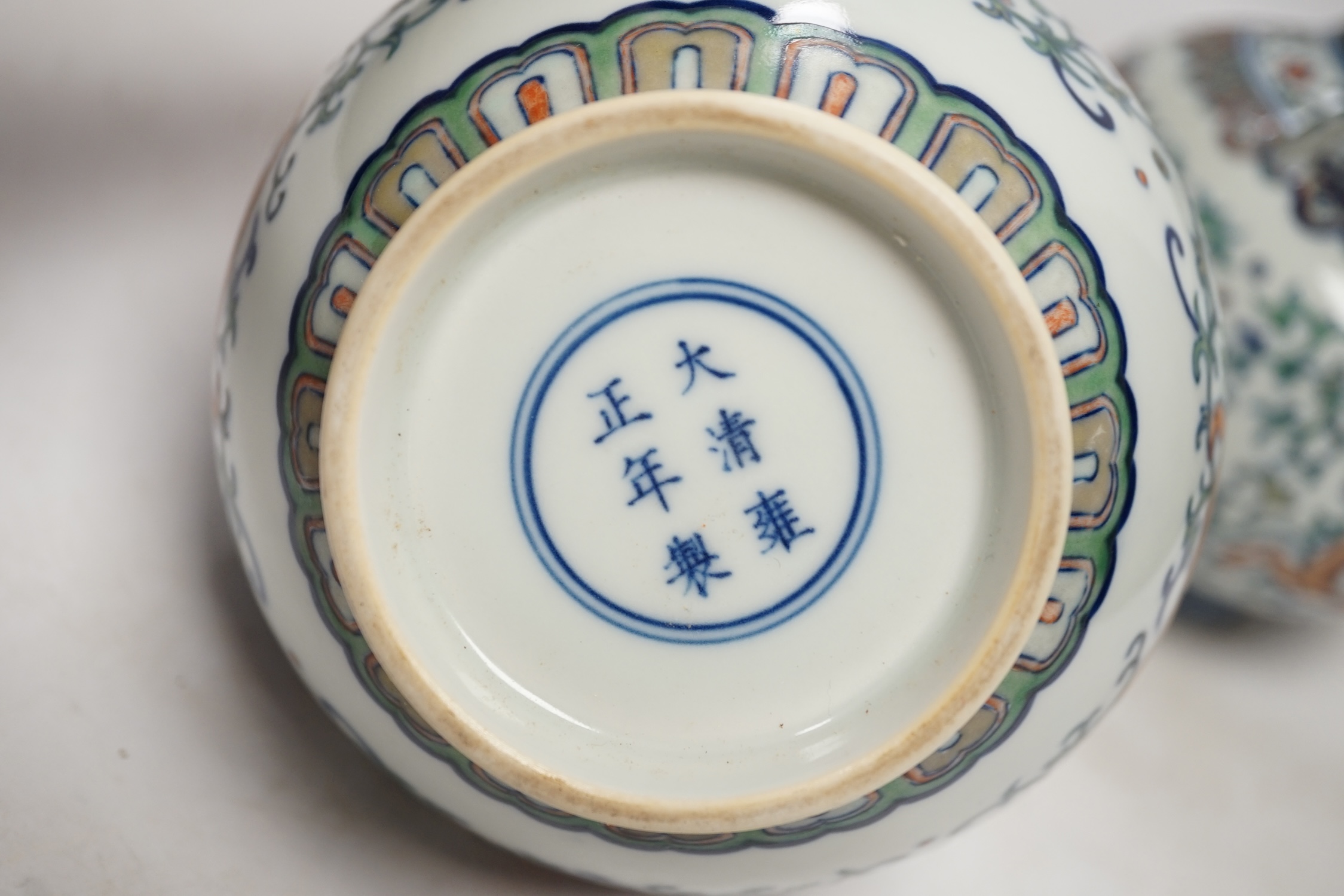 A pair of Chinese porcelain doucai twin handled ‘dragon’ jars, 14cm high. Condition - good